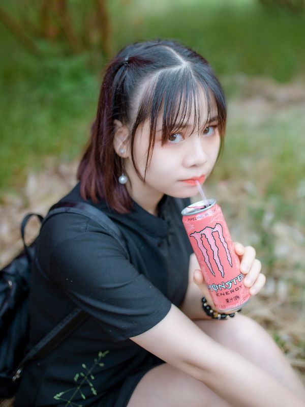 woman drinking monster energy